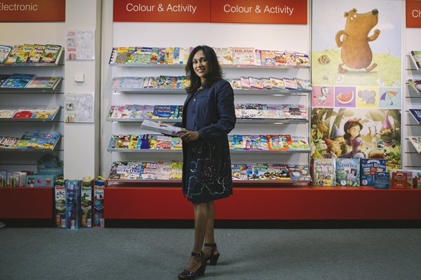 women standing infront of store