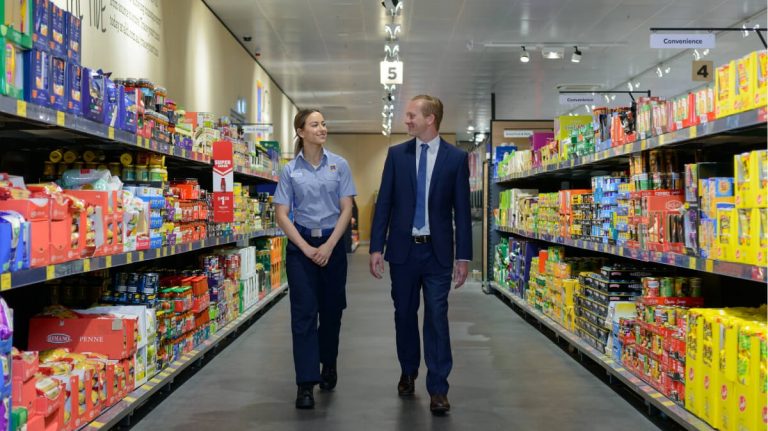 employee walking in supermarket