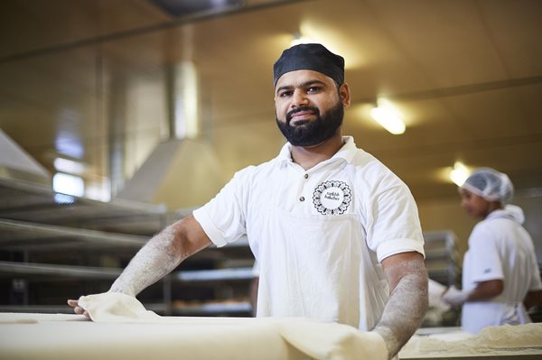 man working in bakery shop