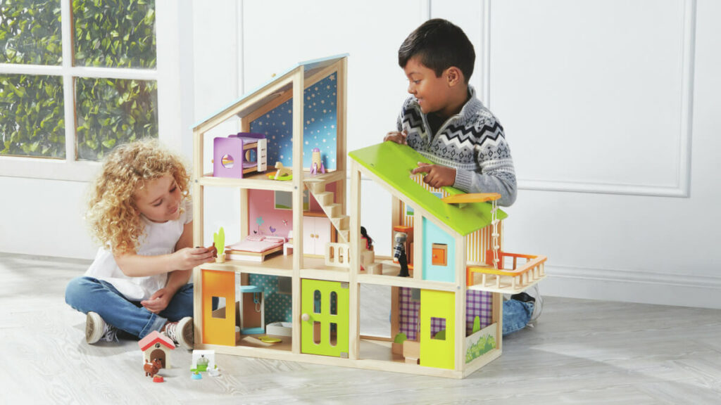 children building wooden toy house