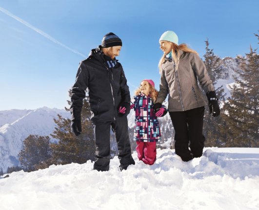 a family enjoying in snow with ALDI’s Snow Gear